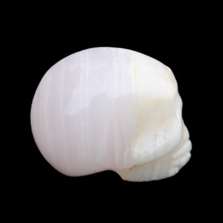 Mangano Calcite skull 31*46*36mm 83g in sunlight - Rocks and Things Store