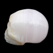 Mangano Calcite skull 31*46*36mm 83g in sunlight - Rocks and Things Store