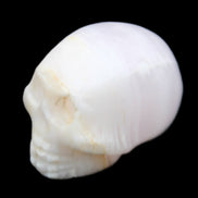 Mangano Calcite skull 31*46*36mm 83g in sunlight - Rocks and Things Store