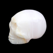 Mangano Calcite skull 31*46*36mm 83g in sunlight - Rocks and Things Store