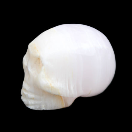 Mangano Calcite skull 31*46*36mm 83g in sunlight - Rocks and Things Store