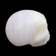 Mangano Calcite skull 31*46*36mm 83g in sunlight - Rocks and Things Store