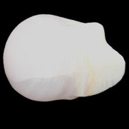 Mangano Calcite skull 31*46*36mm 83g in sunlight - Rocks and Things Store