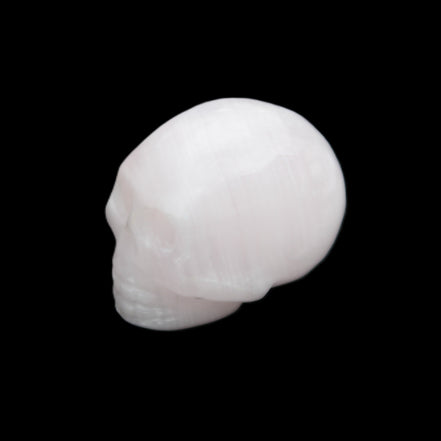 Mangano Calcite skull 30*45*38mm 78g in sunlight - Rocks and Things Store