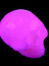 Mangano Calcite skull 30*45*38mm 78g in UV light - Rocks and Things Store