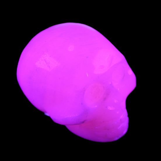 Mangano Calcite skull 30*45*38mm 78g in UV light - Rocks and Things Store