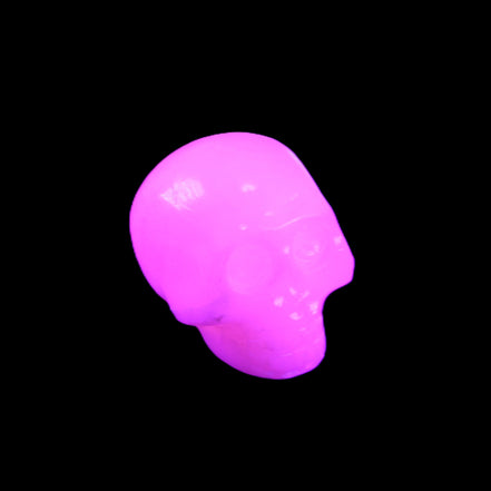 Mangano Calcite skull 30*45*38mm 78g in UV light - Rocks and Things Store