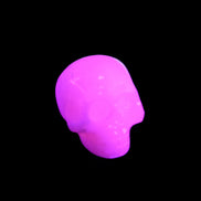 Mangano Calcite skull 30*45*38mm 78g in UV light - Rocks and Things Store