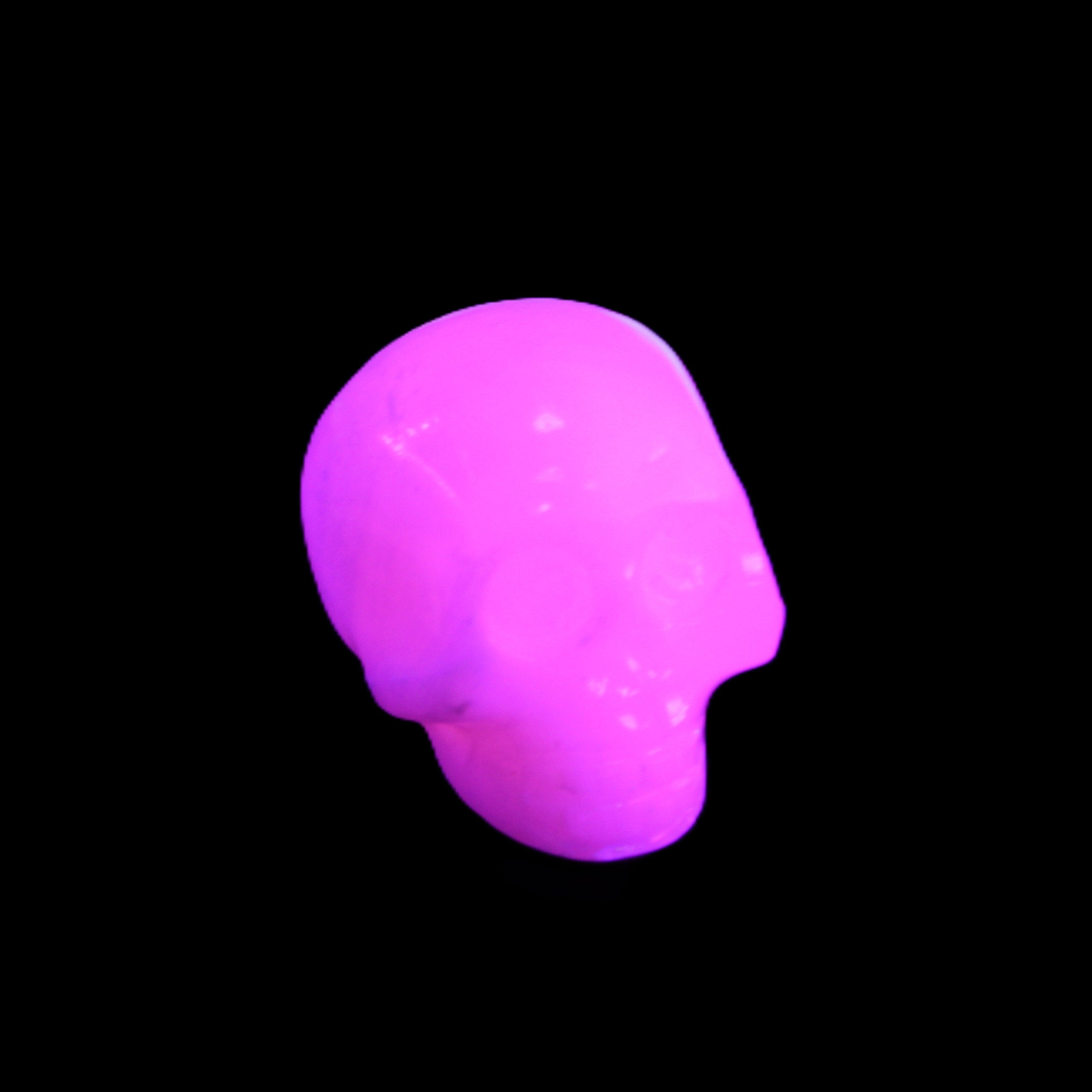 Mangano Calcite skull 30*45*38mm 78g in UV light - Rocks and Things Store