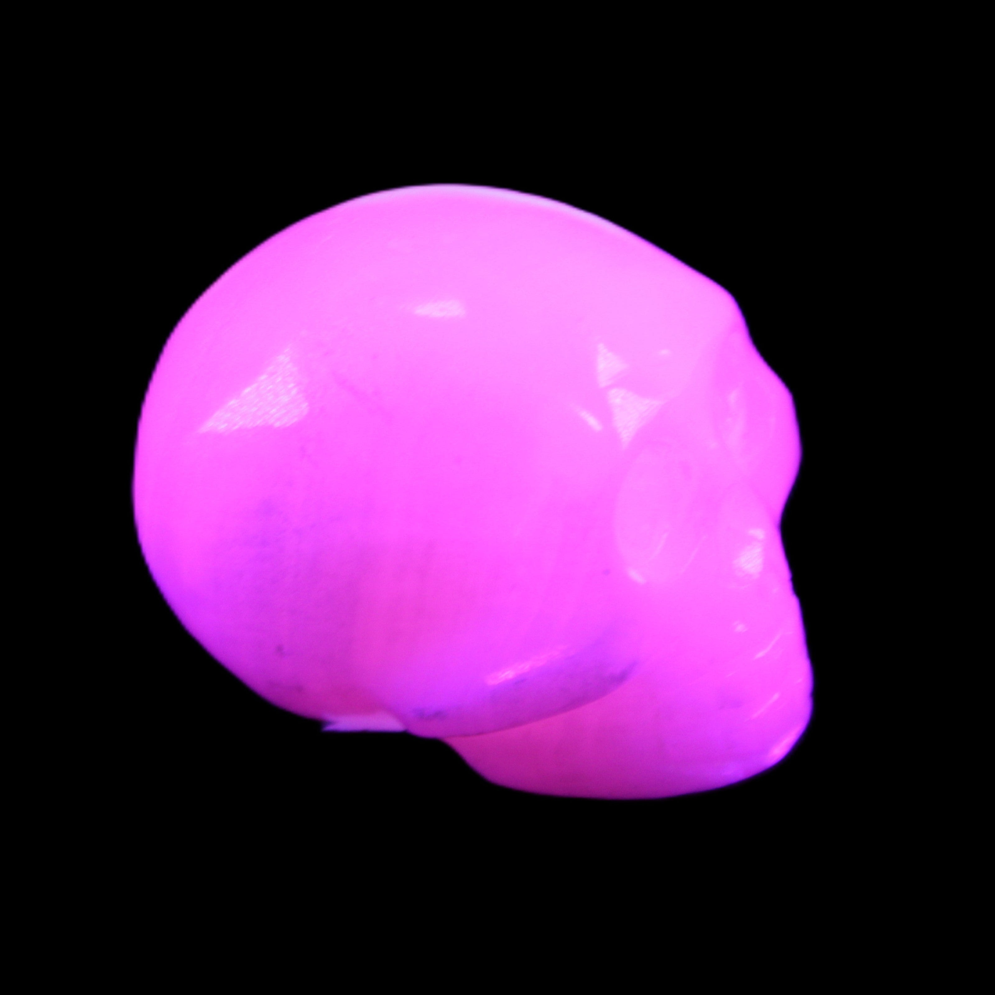 Mangano Calcite skull 30*45*38mm 78g in UV light - Rocks and Things Store