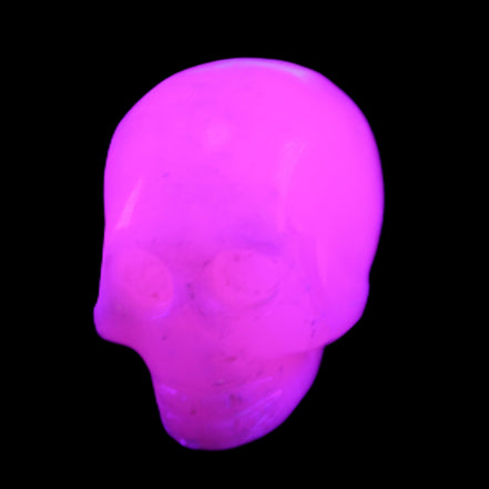 Mangano Calcite skull 30*45*38mm 78g in UV light - Rocks and Things Store