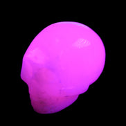 Mangano Calcite skull 30*45*38mm 78g in UV light - Rocks and Things Store