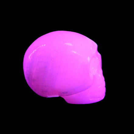 Mangano Calcite skull 30*45*38mm 78g in UV light - Rocks and Things Store