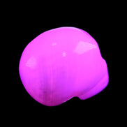 Mangano Calcite skull 30*45*38mm 78g in UV light - Rocks and Things Store
