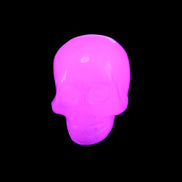 Mangano Calcite skull 30*45*38mm 78g in UV light - Rocks and Things Store