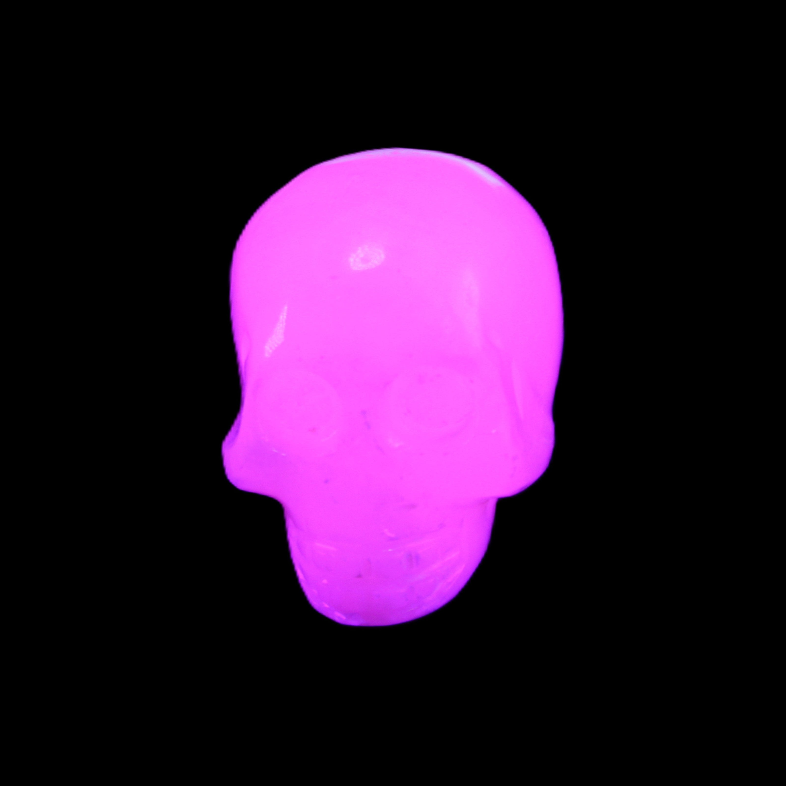 Mangano Calcite skull 30*45*38mm 78g in UV light - Rocks and Things Store