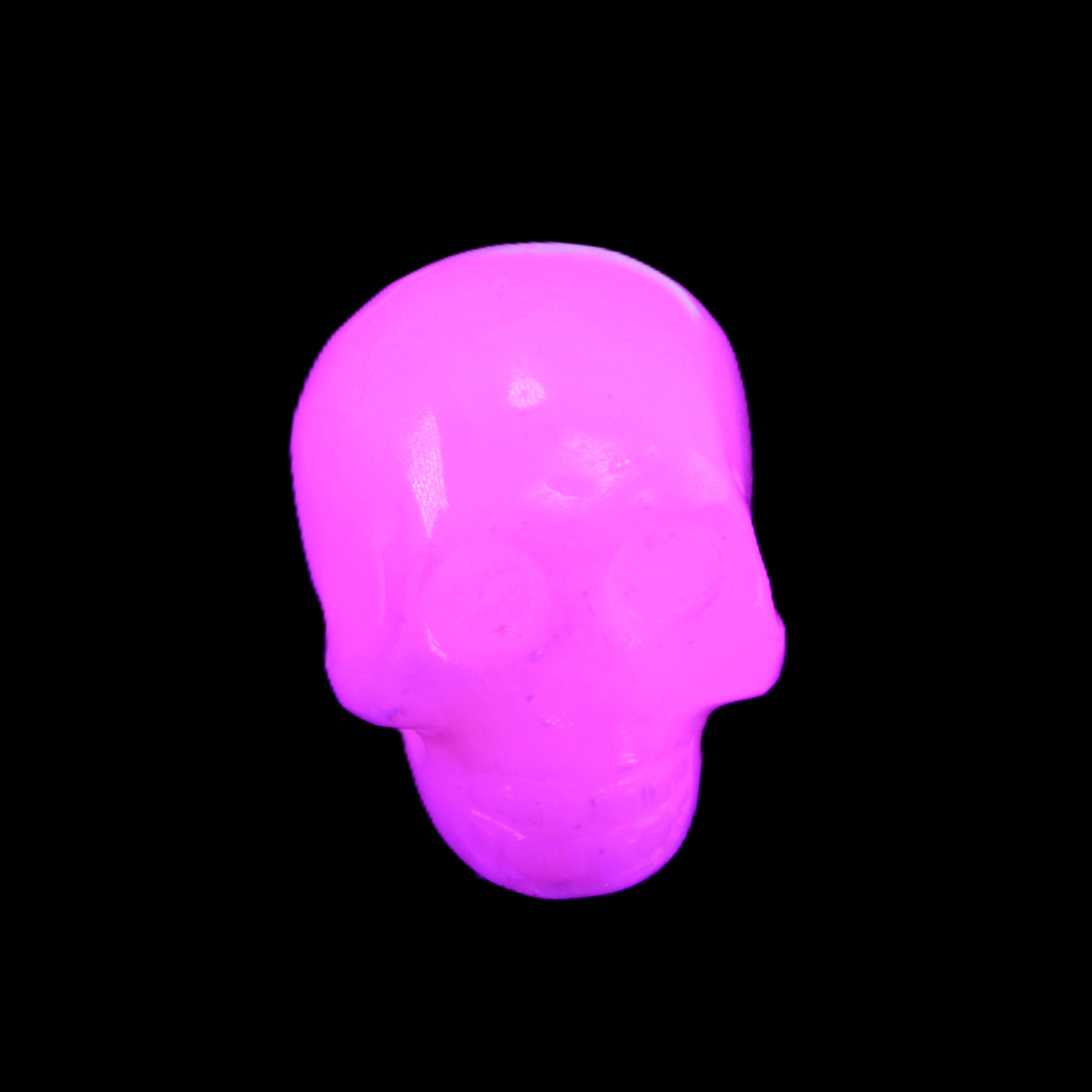 Mangano Calcite skull 30*45*38mm 78g in UV light - Rocks and Things Store
