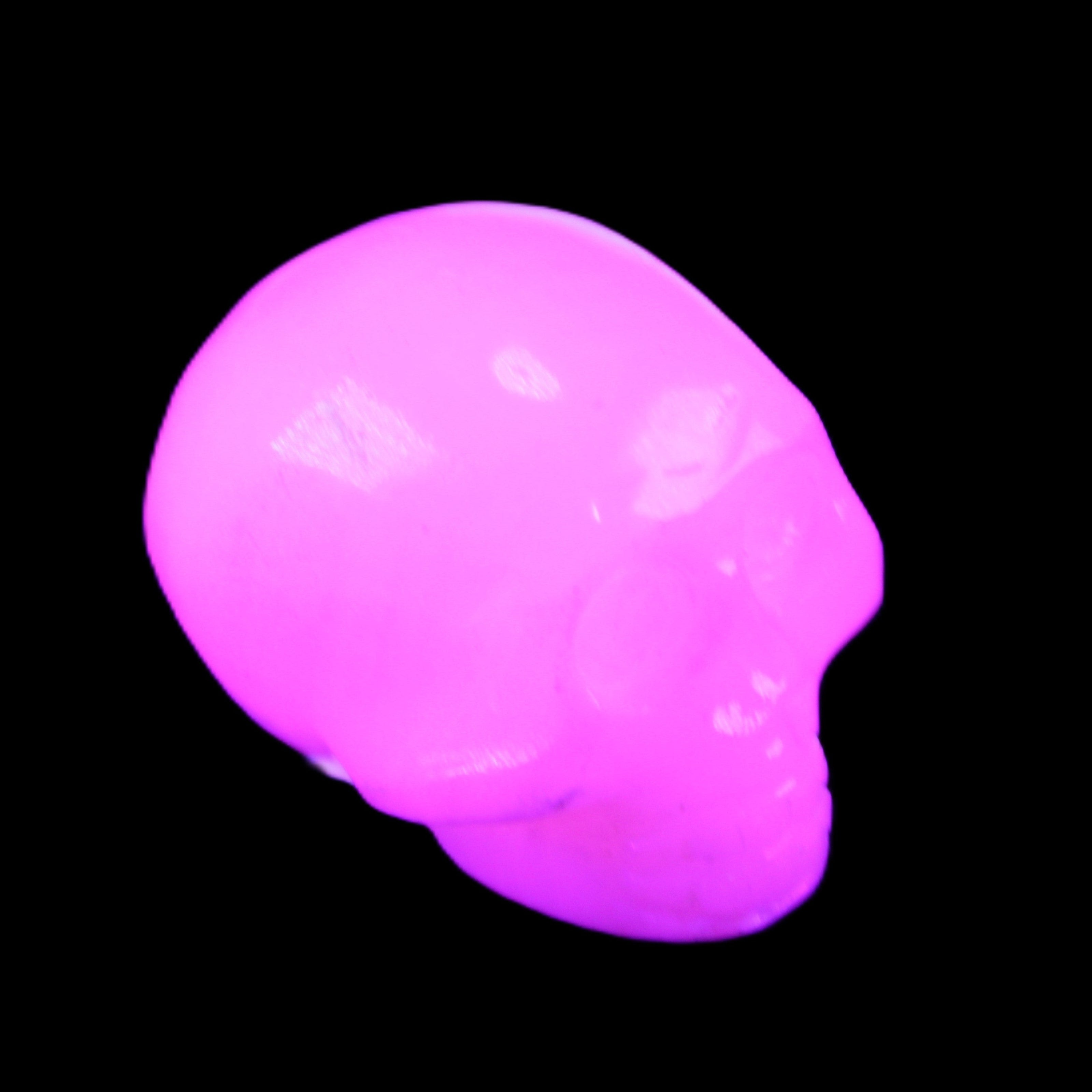 Mangano Calcite skull 30*45*38mm 78g in UV light - Rocks and Things Store