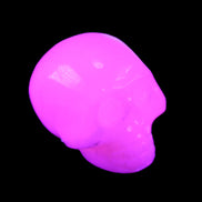 Mangano Calcite skull 30*45*38mm 78g in UV light - Rocks and Things Store