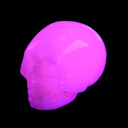 Mangano Calcite skull 30*45*38mm 78g in UV light - Rocks and Things Store