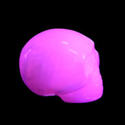 Mangano Calcite skull 30*45*38mm 78g in UV light - Rocks and Things Store