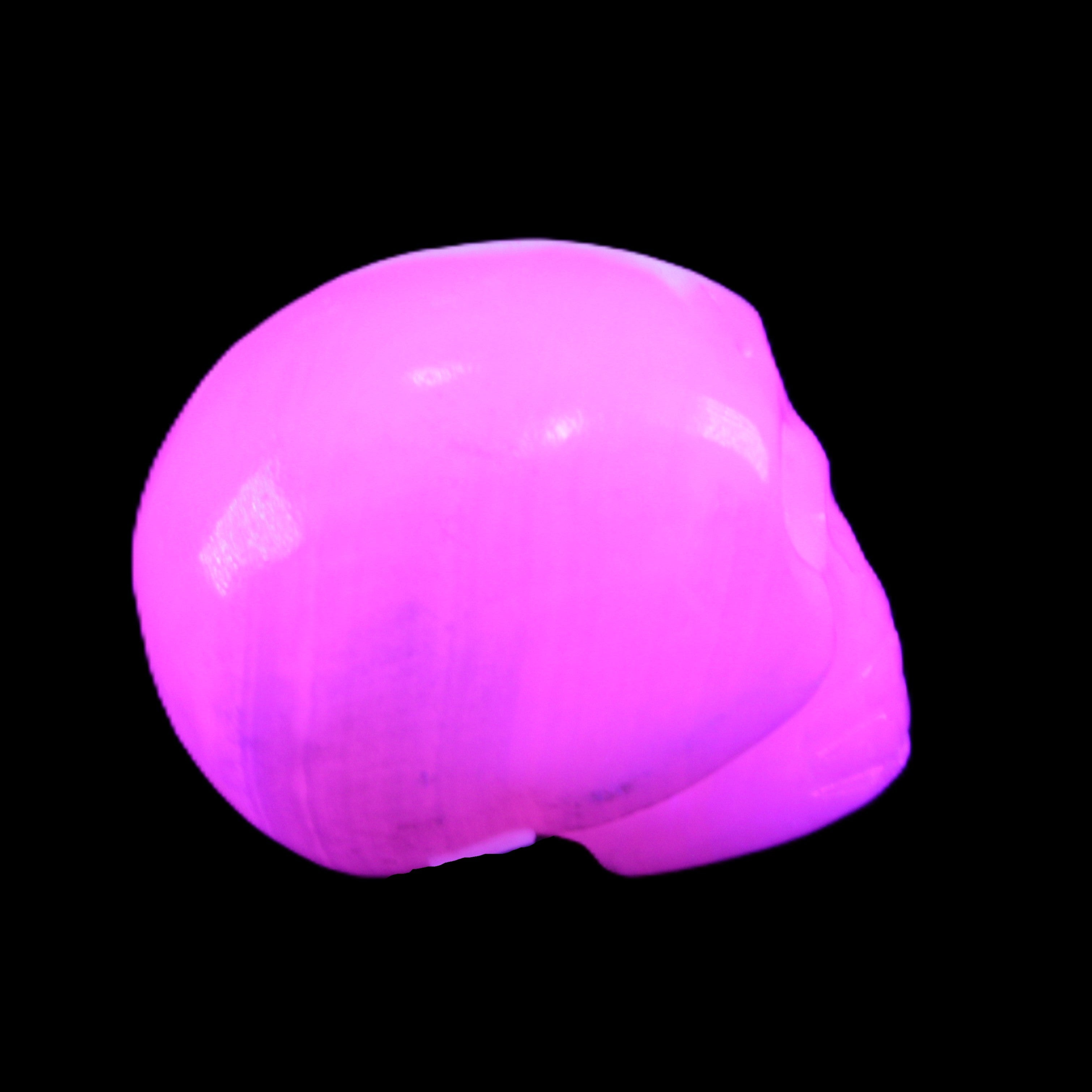Mangano Calcite skull 30*45*38mm 78g in UV light - Rocks and Things Store