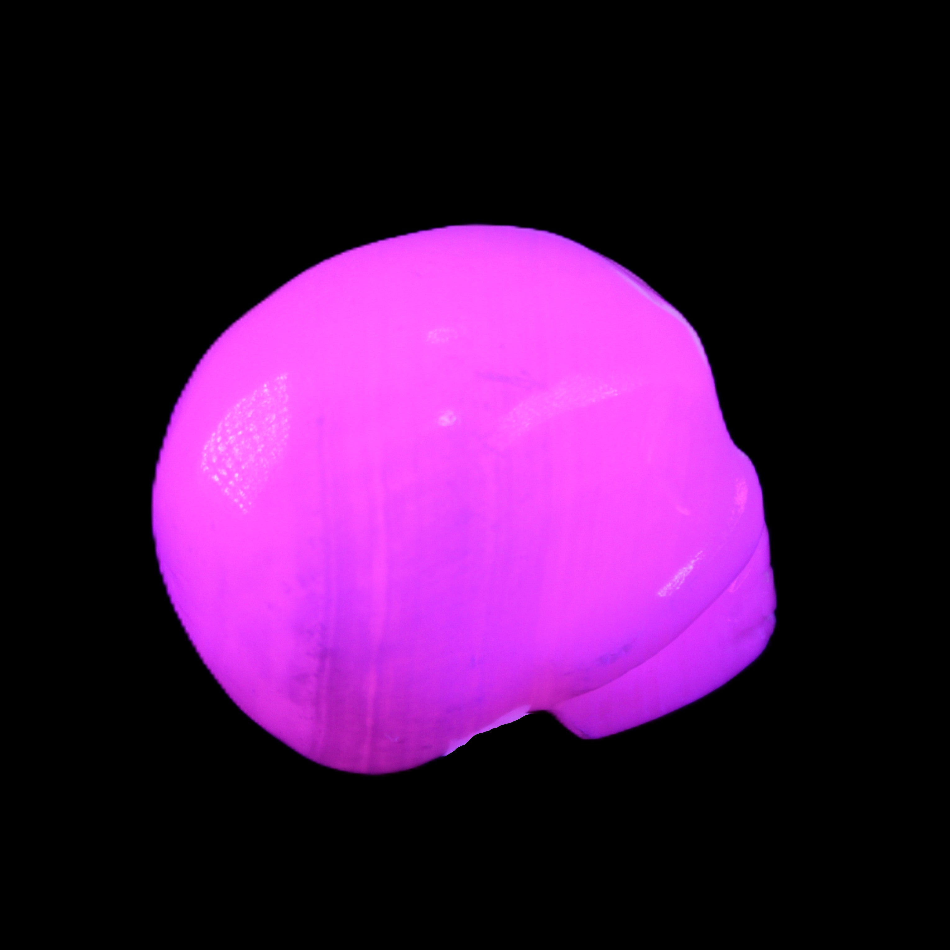 Mangano Calcite skull 30*45*38mm 78g in UV light - Rocks and Things Store