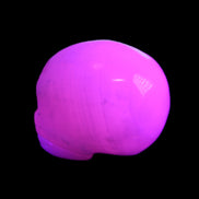 Mangano Calcite skull 30*45*38mm 78g in UV light - Rocks and Things Store