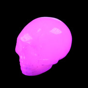 Mangano Calcite skull 30*45*38mm 78g in UV light - Rocks and Things Store