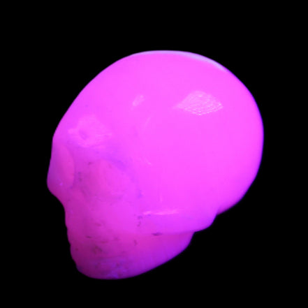 Mangano Calcite skull 30*45*38mm 78g in UV light - Rocks and Things Store