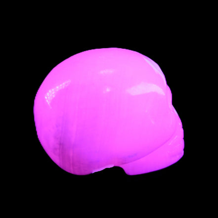 Mangano Calcite skull 30*45*38mm 78g in UV light - Rocks and Things Store