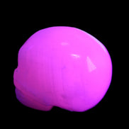Mangano Calcite skull 30*45*38mm 78g in UV light - Rocks and Things Store