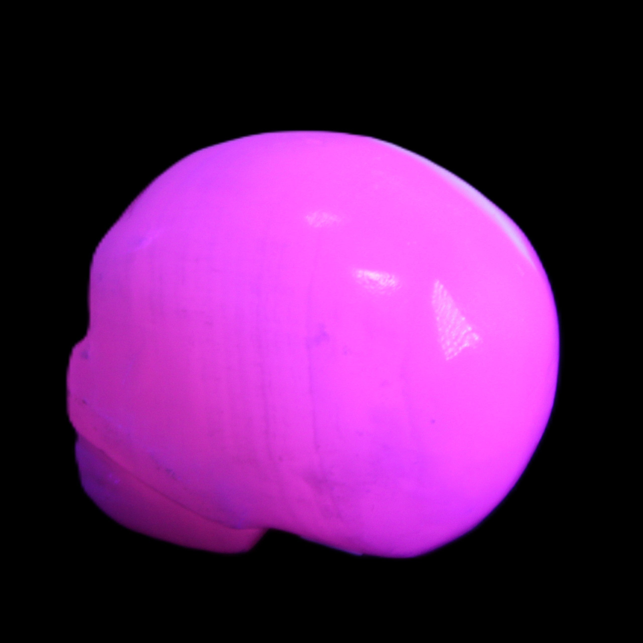Mangano Calcite skull 30*45*38mm 78g in UV light - Rocks and Things Store