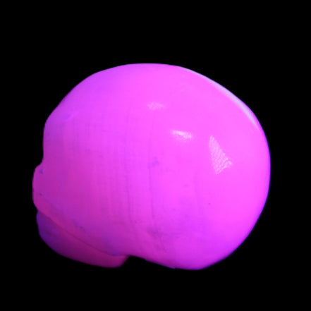 Mangano Calcite skull 30*45*38mm 78g in UV light - Rocks and Things Store