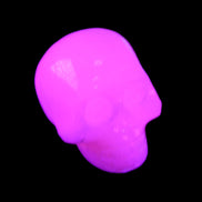 Mangano Calcite skull 30*45*38mm 78g in UV light - Rocks and Things Store