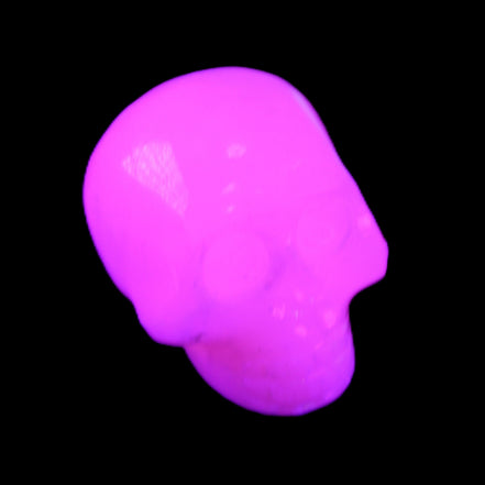 Mangano Calcite skull 30*45*38mm 78g in UV light - Rocks and Things Store