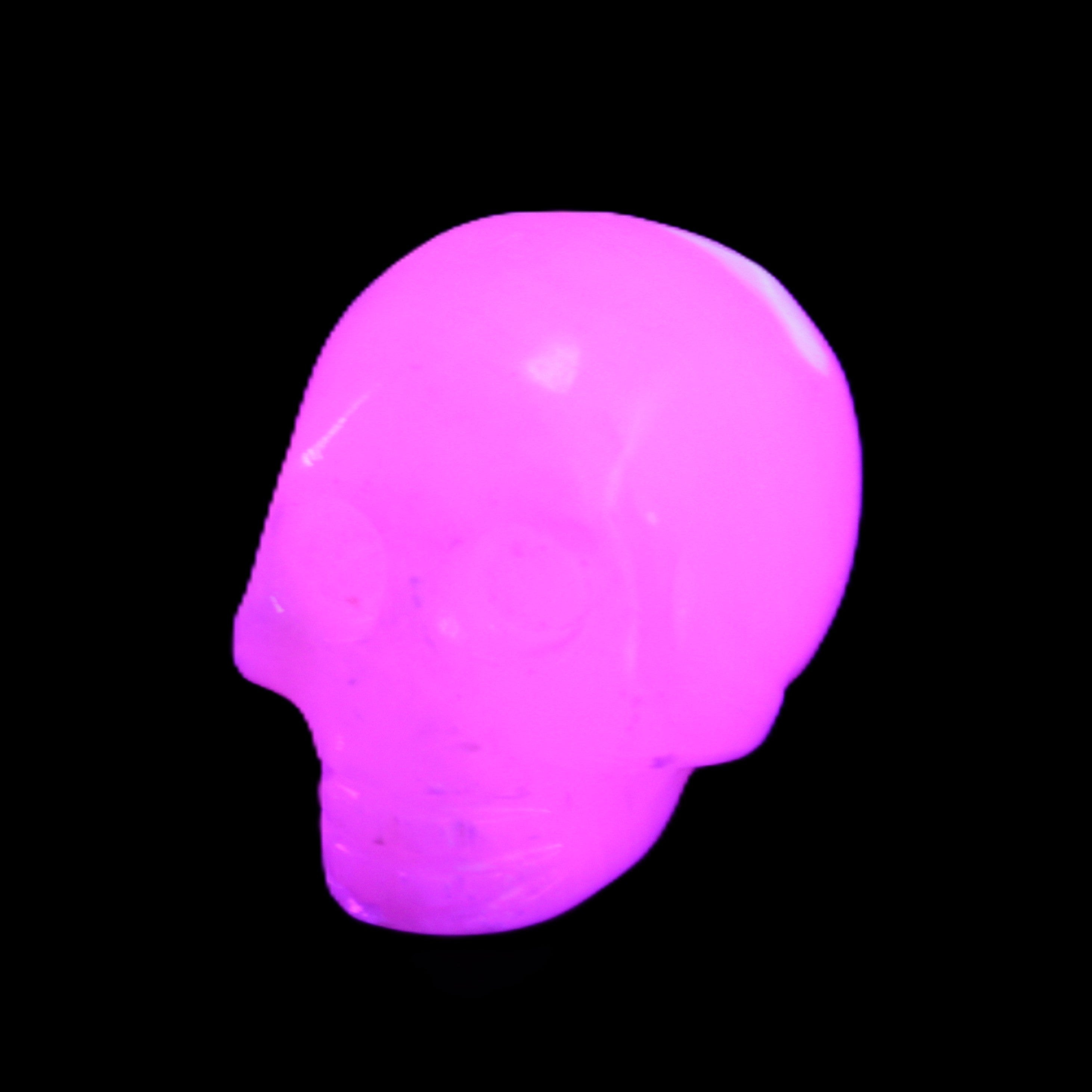 Mangano Calcite skull 30*45*38mm 78g in UV light - Rocks and Things Store