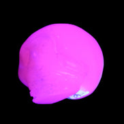 Mangano Calcite skull 30*45*38mm 78g in UV light - Rocks and Things Store