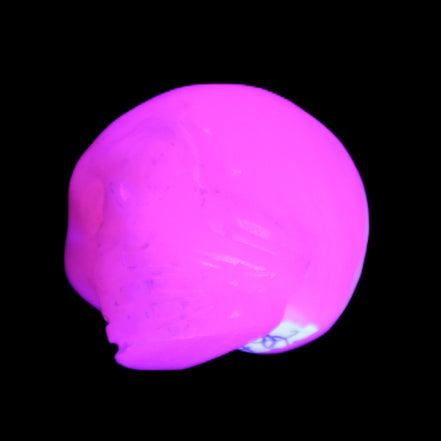 Mangano Calcite skull 30*45*38mm 78g in UV light - Rocks and Things Store