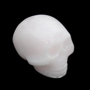 Mangano Calcite skull 30*45*38mm 78g in sunlight - Rocks and Things Store