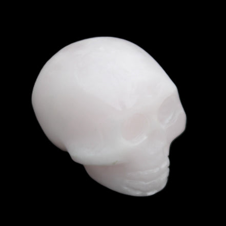 Mangano Calcite skull 30*45*38mm 78g in sunlight - Rocks and Things Store