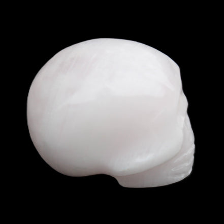 Mangano Calcite skull 30*45*38mm 78g in sunlight - Rocks and Things Store