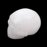 Mangano Calcite skull 30*45*38mm 78g in sunlight - Rocks and Things Store