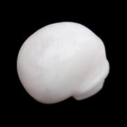 Mangano Calcite skull 30*45*38mm 78g in sunlight - Rocks and Things Store