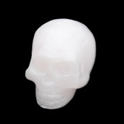 Mangano Calcite skull 30*45*38mm 78g in sunlight - Rocks and Things Store