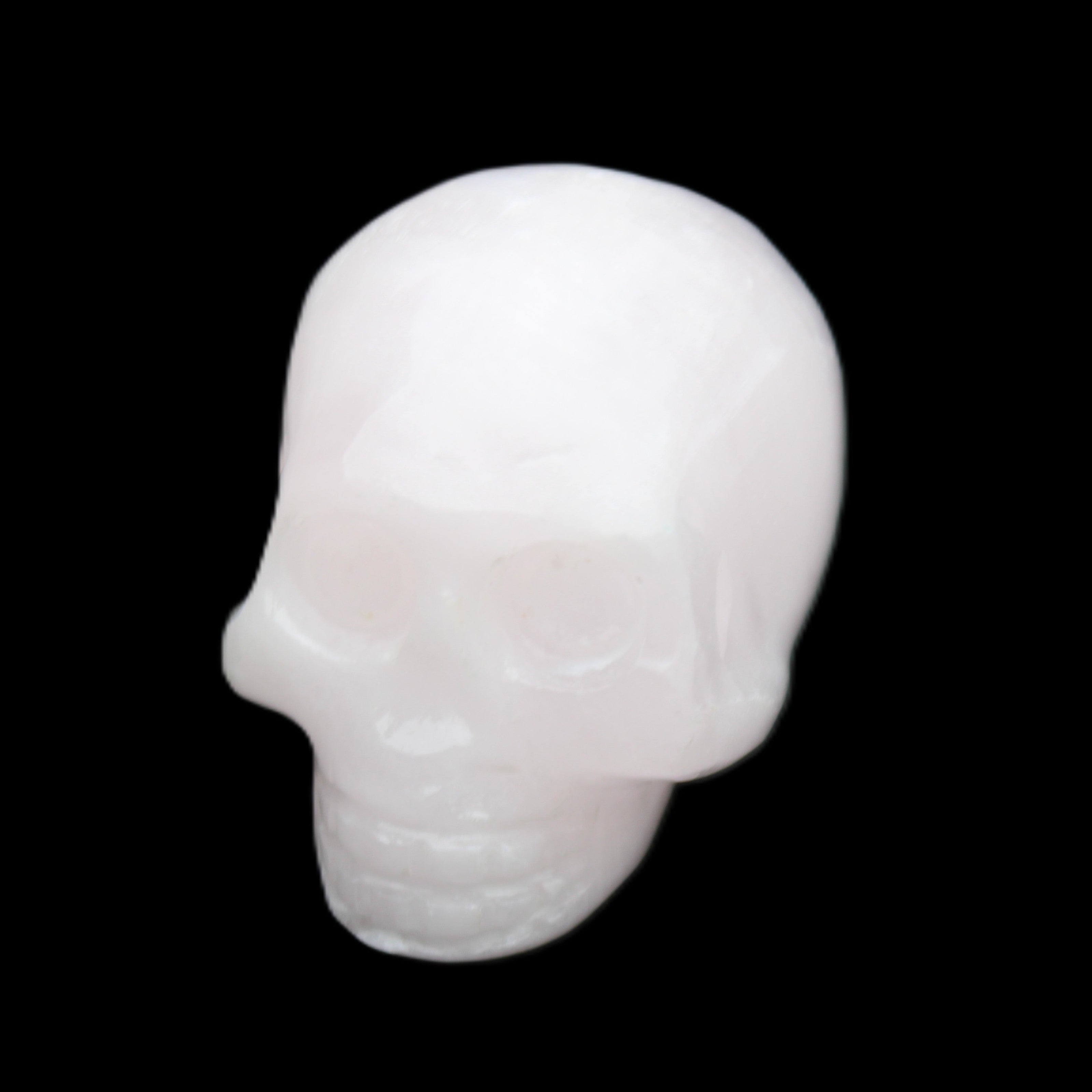 Mangano Calcite skull 30*45*38mm 78g in sunlight - Rocks and Things Store