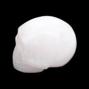 Mangano Calcite skull 30*45*38mm 78g in sunlight - Rocks and Things Store