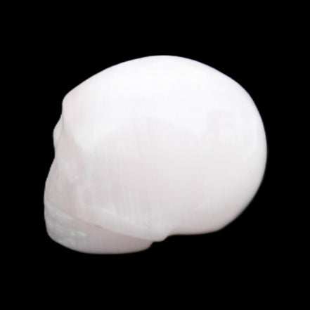 Mangano Calcite skull 30*45*38mm 78g in sunlight - Rocks and Things Store