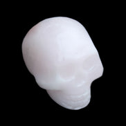Mangano Calcite skull 30*45*38mm 78g in sunlight - Rocks and Things Store