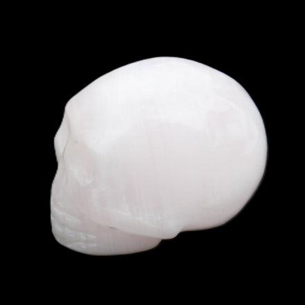 Mangano Calcite skull 30*45*38mm 78g in sunlight - Rocks and Things Store